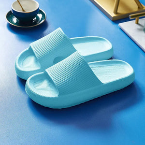 Light blue cloud slippers on a table
