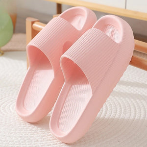 Pink cloud slippers on a white background