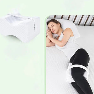 Woman sleeping on her side with knee pillow and leg strap