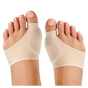 Pair of beige bunion protector sleeves worn on both feet